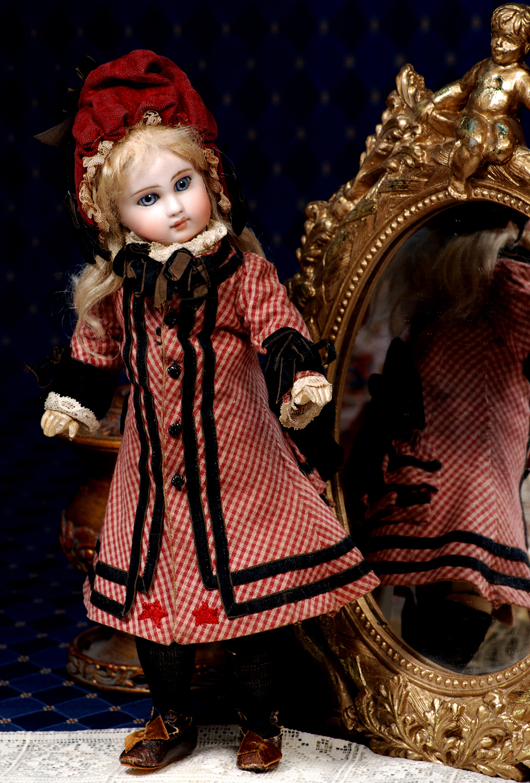 Circa-1885 Sonneberg bisque doll by mystery maker, all original, 13 inches, bisque socket head with blue paperweight eyes, composition jointed body, original factory chemise. Estimate $2,000-$3,000. Image courtesy of Frasher's Doll Auction.